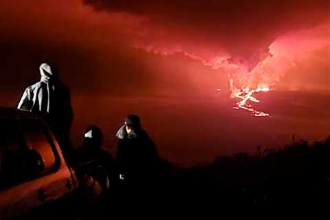 Big Island’s new attraction: Mauna Loa spewing red-glowing lava against black skies