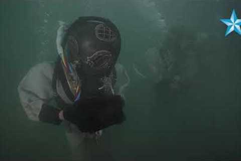 Divers place USS Arizona crew member Lauren Bruner''s urn onto famed battleship